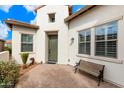 Front entry with green door and wooden bench at 578 E Laddoos Ave, San Tan Valley, AZ 85140