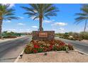 Encanterra community entrance with stone sign and flowers at 578 E Laddoos Ave, San Tan Valley, AZ 85140