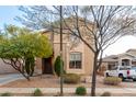 Two-story house with tan exterior, landscaping, and a driveway at 2529 W Florentine Rd, Phoenix, AZ 85086