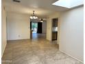 Bright dining area with tile floors and views into the living room and kitchen at 7006 E Jensen St # 83, Mesa, AZ 85207