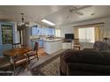 Open living and kitchen area with light-colored cabinetry at 8700 E University Dr # 1322, Mesa, AZ 85207