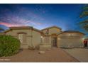 Tan house with a two-car garage and landscaping at 291 N Cottonwood St, Chandler, AZ 85225