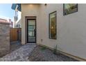 Stylish front door with sidelight window and brick pathway at 1 Easy St # 17, Carefree, AZ 85377