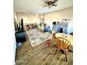 Spacious living room with stone fireplace and wood-look flooring at 205 N Cameron Ave, Casa Grande, AZ 85122