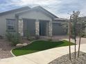 Charming one-story home with landscaping and curb appeal at 15935 W Montana De Oro Dr, Surprise, AZ 85387