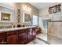 Spacious bathroom with double sinks, granite countertops, and a walk-in shower at 16449 W Shangri La Rd, Surprise, AZ 85388
