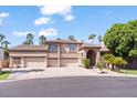 Two story home with three car garage and lush landscaping at 580 N Benson Ln, Chandler, AZ 85224