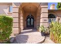 Elegant entryway with ornate double doors and brick walkway at 580 N Benson Ln, Chandler, AZ 85224