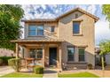 Two-story house with front porch and landscaping at 15402 W Old Oak Ln, Surprise, AZ 85379