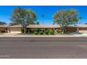 Attractive exterior of a single-story home with a well-maintained lawn at 12620 W Parkwood Dr, Sun City West, AZ 85375