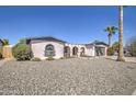 Cute ranch style home with gravel landscaping and palm tree at 4804 W Desert Cove Ave, Glendale, AZ 85304