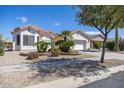 Single story home with two car garage and desert landscaping at 126 S Lucia Ln, Casa Grande, AZ 85194