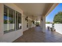 Covered patio with tile flooring, ceiling fan and lighting at 126 S Lucia Ln, Casa Grande, AZ 85194