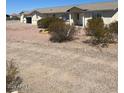 Ranch style home with gravel driveway and desert landscaping at 8190 N Bel Air Rd, Casa Grande, AZ 85194