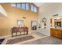 Spacious living room featuring high ceilings and a wet bar at 10434 E Watford Way, Sun Lakes, AZ 85248