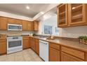 Kitchen with wood cabinets and modern appliances at 16308 E Arrow Dr # 111, Fountain Hills, AZ 85268