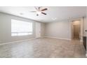 Bright living room with tile floors and neutral walls at 11235 E Pampa Ave, Mesa, AZ 85212