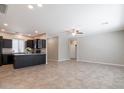 Open kitchen with an island and dark cabinets at 11235 E Pampa Ave, Mesa, AZ 85212