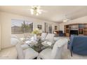 Bright dining area with glass table and seating for six at 1729 Leisure World --, Mesa, AZ 85206