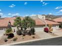 Spanish style home with a two-car garage and mountain views at 8870 E Greenview Dr, Gold Canyon, AZ 85118