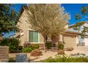Two story home with tan exterior and two car garage at 2440 E Saint Catherine Ave, Phoenix, AZ 85042