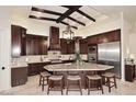 Gourmet kitchen with dark wood cabinets and granite island at 4455 E Quail Brush Rd, Cave Creek, AZ 85331