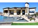 Luxury home with a large pool and outdoor kitchen at 4455 E Quail Brush Rd, Cave Creek, AZ 85331