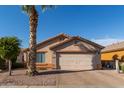 Single-story home with attached garage and desert landscaping at 8714 W Heber Rd, Tolleson, AZ 85353