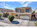 Two-story house with a two-car garage and landscaped yard at 8312 W Pioneer St, Tolleson, AZ 85353