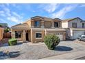Two-story house with a two-car garage and landscaped yard at 8312 W Pioneer St, Tolleson, AZ 85353