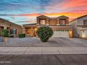 Two-story house with a two-car garage and landscaped yard at 8312 W Pioneer St, Tolleson, AZ 85353