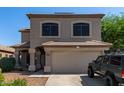 Two-story home with a two-car garage and desert landscaping at 26425 N 42Nd Way, Phoenix, AZ 85050