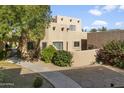 Charming stucco home with walkway and lush desert landscaping at 38065 N Cave Creek Rd # 4, Cave Creek, AZ 85331