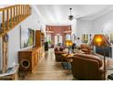 Spacious living room with hardwood floors, fireplace, and leather furniture at 38065 N Cave Creek Rd # 4, Cave Creek, AZ 85331