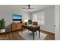 Home office with built-in desk and shelving at 10910 E Oro Ave, Mesa, AZ 85212