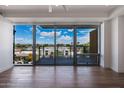 Living room with expansive city view from large window at 4422 N 75Th St # 4011, Scottsdale, AZ 85251