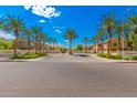 Attractive community entrance with palm trees and landscaping at 2402 E 5Th St # 1481, Tempe, AZ 85288