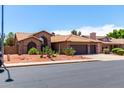 Two-story house with tile roof, two-car garage, and desert landscaping at 5839 E Jensen St, Mesa, AZ 85205