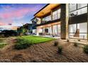 Contemporary home showcasing a spacious backyard and an outdoor dining area at 6311 E Phoenician Blvd # 21, Scottsdale, AZ 85251