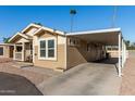 Tan home with carport and small front porch at 649 N 67Th Dr # 25, Phoenix, AZ 85043