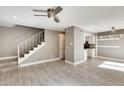 Living room with gray walls, wood-look floors, and stairs at 1045 N Granite Reef Rd, Scottsdale, AZ 85257
