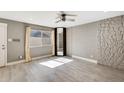 Bedroom with wood-look floors and an accent wall at 1045 N Granite Reef Rd, Scottsdale, AZ 85257