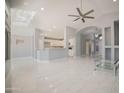 Open living area with tile flooring and a ceiling fan at 7469 W Monona Dr, Glendale, AZ 85308