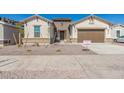 New construction home exterior with two-car garage at 21048 E Arroyo Verde Dr, Queen Creek, AZ 85142