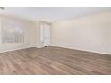 Bright living room with wood-look flooring and neutral walls at 10722 W Jefferson St, Avondale, AZ 85323
