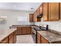 Kitchen with stainless steel appliances and wood cabinets at 10722 W Jefferson St, Avondale, AZ 85323