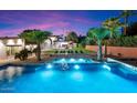 Inviting pool area with palm trees and a spacious patio at 341 E Monte Vista Rd, Phoenix, AZ 85004