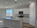 Modern kitchen featuring granite countertops and white cabinetry at 3443 S 177Th Ave, Goodyear, AZ 85338