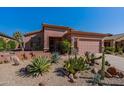 Single-story home with desert landscaping and two-car garage at 4333 S Pony Rider Trl, Gold Canyon, AZ 85118