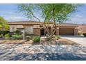 Beautiful one-story home with stone accents and landscaping at 18119 W Narramore Rd, Goodyear, AZ 85338